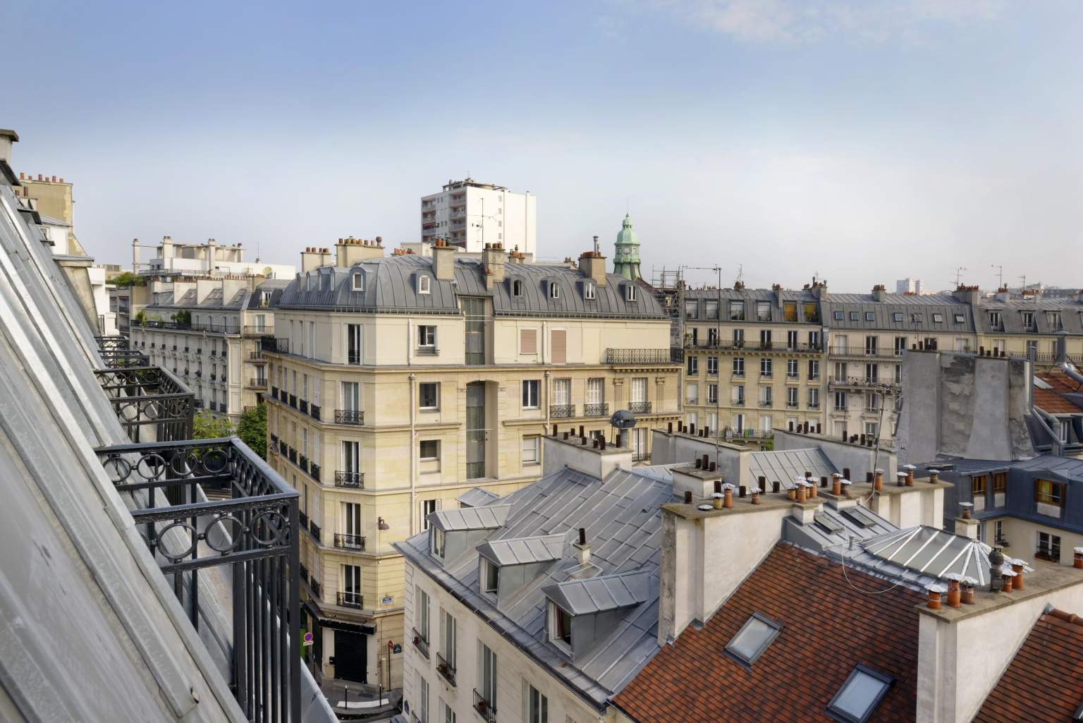 Panoramic view over the Paris rooftops from Le Mareuil Hotel